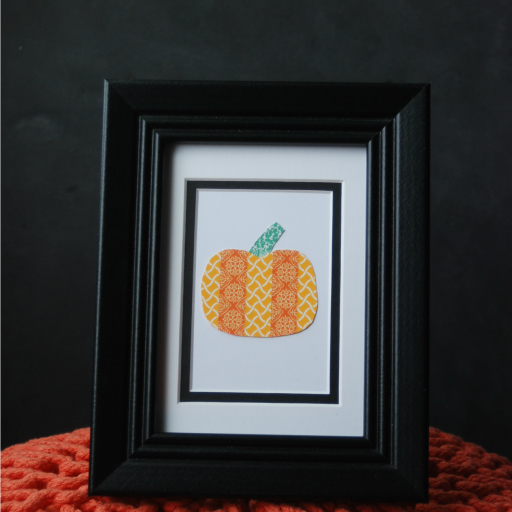 Make a cute framed pumpkin out of washi tape. Adorable fall decor in less than 5 mnutes!