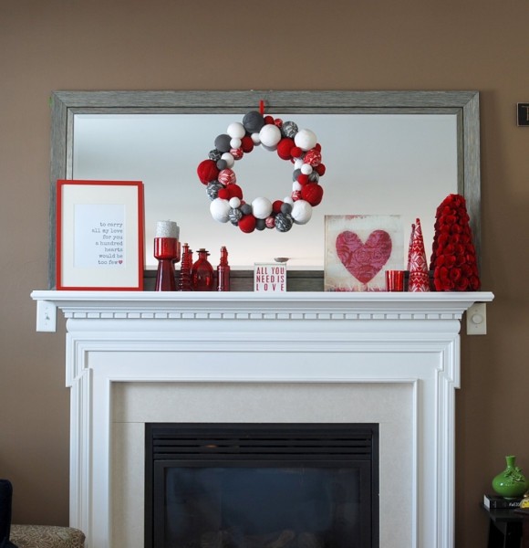 This Valentine's Day mantel is made up almost entirely of decorations that were also used at Christmas! And there's a free printable included! 