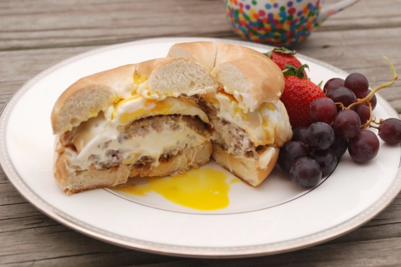 A Philly Cream Cheese-stuffed sausage patty topped with a Kraft Single & a fried egg, served on a toasted bagel with Miracle Whip. #SayCheeseburger #shop