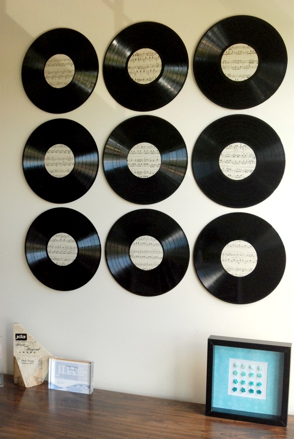 Make awesome new art for your walls out of some old vinyl records and some vintage sheet music! 