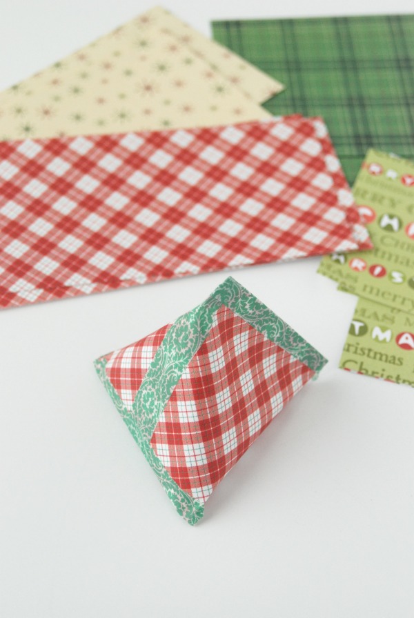 Scrapbook paper pyramid pouch secured with washi tape