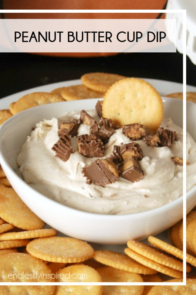 Bowl of peanut butter cup dip topped with chopped peanut butter cups surrounded by Ritz crackers