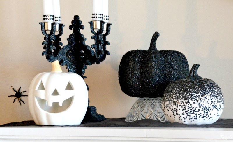 Halloween decor doesn't always have to be traditional orange and black. I love this simple yet elegant mantel!
