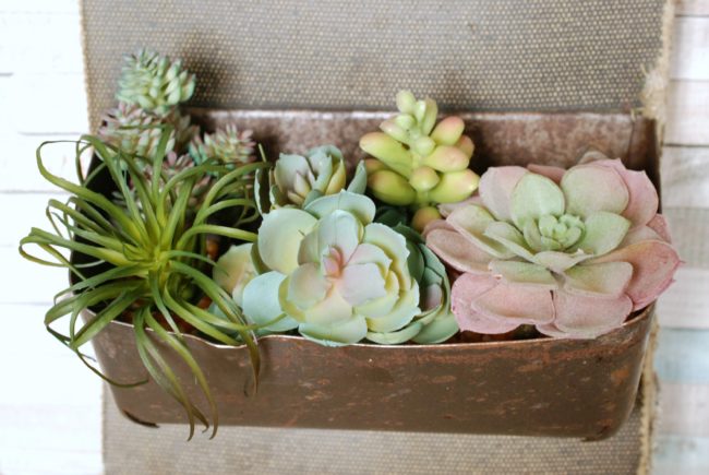Make this rustic succulent planter using faux succulents from the craft store.