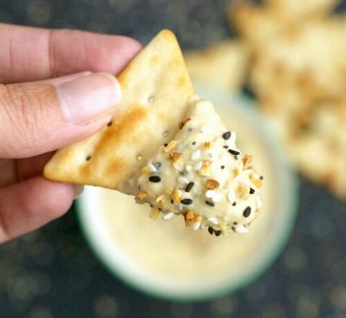 Just like your favorite bagel, this Everything Bagel Hummus recipe uses black and white sesame seeds, poppy seeds, onion flakes, garlic flakes, and sea salt.