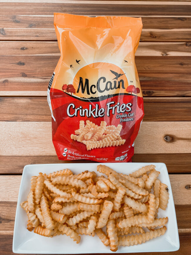 french fries on a plate with a bag of frozen fries