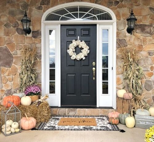 A front porch decorated for fall